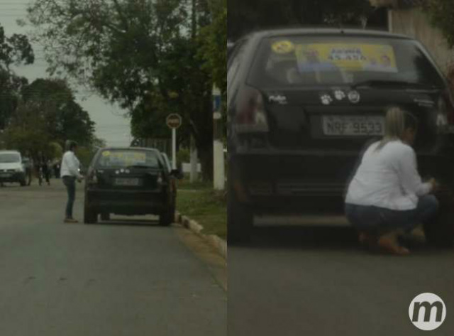 Vânia Marques, segundo a denúncia, escondeu-se atrás do carro assim que viu que era espiada